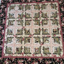 Susan K Quilting - What gorgeous rose fabrics were chosen for this log cabin quilt. It looks as beautiful close up as it does from afar!