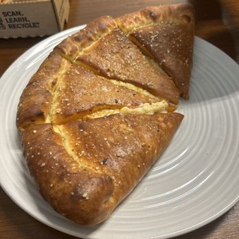 Pizza Pro Partners Grill - a piece of bread on a plate - Burgers Near Me - Comanche, Texas Pizza Pro Partners Grill - a piece of bread on a plate - Burgers Near Me - Comanche, Texas