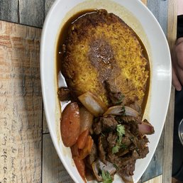 Lomo Con Pollo --I think? Lomo saltado with a traditional rice and bean pilaf. Incredibly flavorful! Lomo Con Pollo --I think? Lomo saltado with a traditional rice and bean pilaf. Incredibly flavorful!