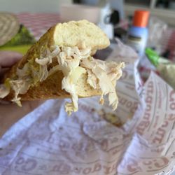 Sourdough & Co - Turkey sandwich, uncut, with turkey coming out all over the place