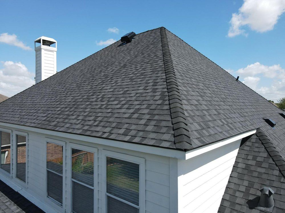 Slide of Core Four Roofing