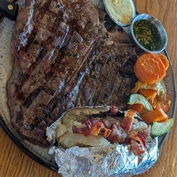 Porterhouse with loaded bake potato and seasonal veg