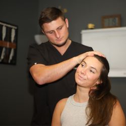 Life Charge Chiropractic - Dr. Palmer performing and adjustment