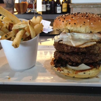 Eureka! - The BONE MARROW BURGER w/double meat & it's goodie friends... Bacon, herb sautéed wild mushrooms & 2 sunny side up fried eggs + fries *slap* - American Near Me - Concord, California