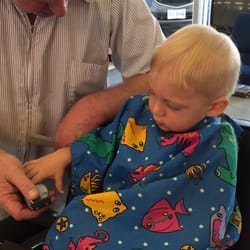 A-Plus Barber & Style Shop - Jimmy letting my son touch the clippers so he knows there's nothing to be afraid of