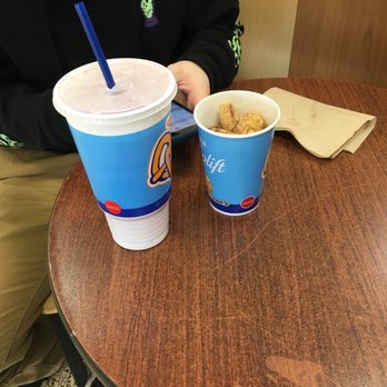 Auntie Anne's - a man sitting at a table with two cups of coffee - Pretzels Near Me - Des Moines, Iowa Auntie Anne's - a man sitting at a table with two cups of coffee - Pretzels Near Me - Des Moines, Iowa