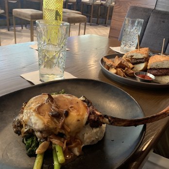 Delaney's Tavern - Tomahawk Pork Chop & Ribeye Sandwich! - New American Near Me - Orlando, Florida