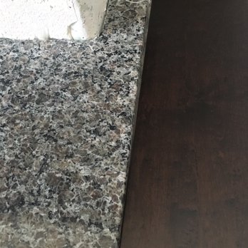 Stonehenge Custom Countertops, Inc. - How our new granite hearth looks against our new hardwood floor (floors installed by Legacy flooring - look for my review here on Yelp). - Countertop Installation Near Me