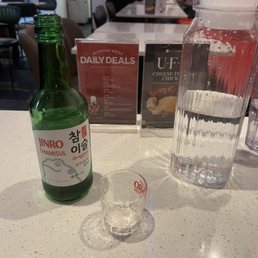 Sipping soju while waiting for our takeout order