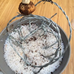 Zarzo - Beef Wellington bite presented on barbed wire.