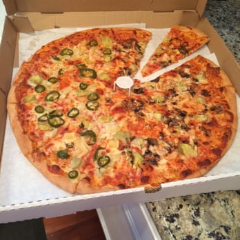 Italian Express - Their huge pizza with artichokes, pineapple and jalapeños on one side and artichokes, chicken and mushroom on the other - Italian Near Me - Tustin, California Italian Express - Their huge pizza with artichokes, pineapple and jalapeños on one side and artichokes, chicken and mushroom on the other - Italian Near Me - Tustin, California