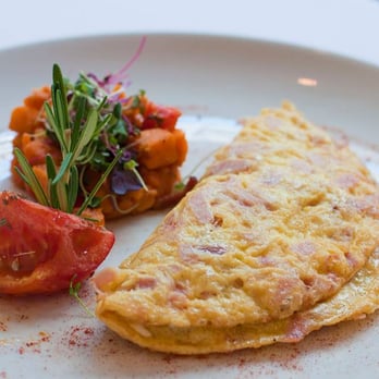 Bistro Milano - an omelet with a side salad - Italian Near Me - New York, New York Bistro Milano - an omelet with a side salad - Italian Near Me - New York, New York