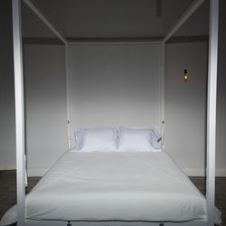 Dungeon East - Queen size canopy bed with attachment points all around.