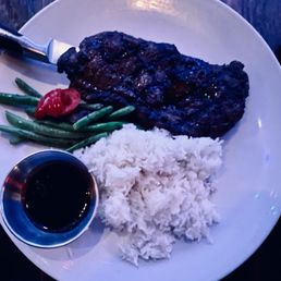 11 ounce New York Steak with rice and vegetables. 11 ounce New York Steak with rice and vegetables.
