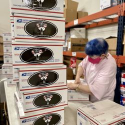 Soldiers' Angels volunteers pack care packages for deployed Service Members at the San Antonio warehouse.