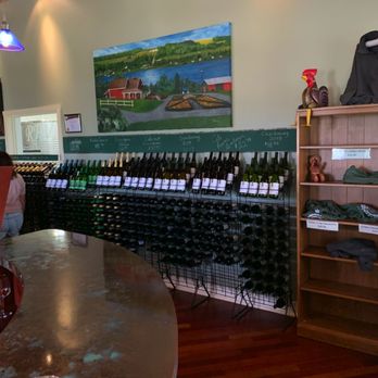 Rooster Hill Vineyards - a wine rack with bottles of wine - Wineries Near Me - Penn Yan, New York Rooster Hill Vineyards - a wine rack with bottles of wine - Wineries Near Me - Penn Yan, New York