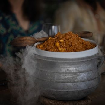 Ileishome - a steaming pot of food on a table - African Near Me - Los Angeles, California Ileishome - a steaming pot of food on a table - African Near Me - Los Angeles, California