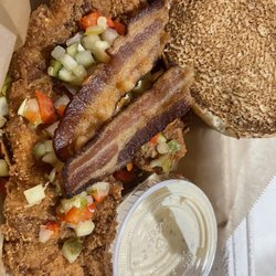 Sammie Up - Tabasco buttermilk brined crispy chicken breast, bacon, pickle de gallo, and siracha ranch on a grilled brioche.