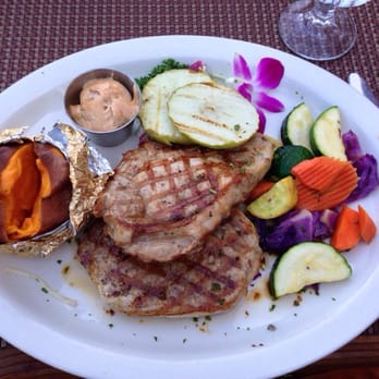 Cowboy Grill at Redcliffs Lodge - Grilled pork chips with baked apples and yam - American Near Me - Moab, Utah Cowboy Grill at Redcliffs Lodge - Grilled pork chips with baked apples and yam - American Near Me - Moab, Utah