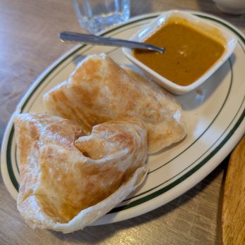 IPOH Garden Malaysian Cuisine - Flaky, buttery, and torn to absolute perfection. If you aren't dipping this roti into every last drop of curry, you're doing it wrong. - Malaysian Near Me - Millbrae, California IPOH Garden Malaysian Cuisine - Flaky, buttery, and torn to absolute perfection. If you aren't dipping this roti into every last drop of curry, you're doing it wrong. - Malaysian Near Me - Millbrae, California