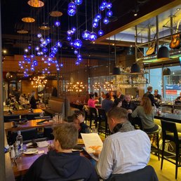 people eating at a restaurant people eating at a restaurant