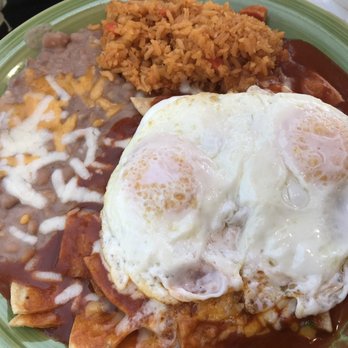 La Adelita - Chilaquiles con Huevos ($11.99) in red sauce, served with rice and beans. - Mexican Near Me - Monrovia, California La Adelita - Chilaquiles con Huevos ($11.99) in red sauce, served with rice and beans. - Mexican Near Me - Monrovia, California