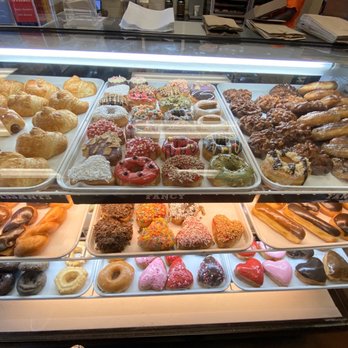 Glaze Doughnuts - Small case up front but the cashier filled our box from tall racks of fresh donuts behind the counter. - Donuts Near Me - Las Vegas, Nevada Glaze Doughnuts - Small case up front but the cashier filled our box from tall racks of fresh donuts behind the counter. - Donuts Near Me - Las Vegas, Nevada