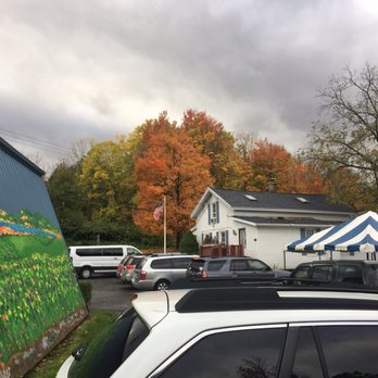 Arbor Hill Grapery & Winery - The fall colors are really beautiful. You can also see the mural & the events tent set up behind the main building. - Wineries Near Me - Naples, New York Arbor Hill Grapery & Winery - The fall colors are really beautiful. You can also see the mural & the events tent set up behind the main building. - Wineries Near Me - Naples, New York