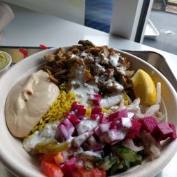 Rice, chicken shwarma, spicy hummus, pickled beets/turnips, tomatoes, garlic sauce Rice, chicken shwarma, spicy hummus, pickled beets/turnips, tomatoes, garlic sauce