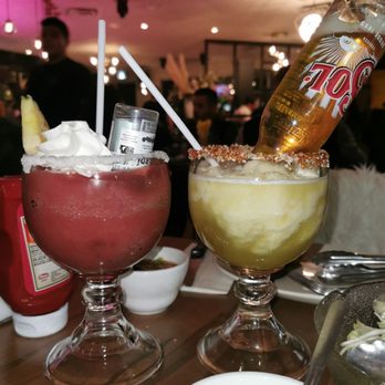 Le Milsa - a person pouring a drink into a glass - Brazilian Near Me - Pierrefonds, Quebec Le Milsa - a person pouring a drink into a glass - Brazilian Near Me - Pierrefonds, Quebec