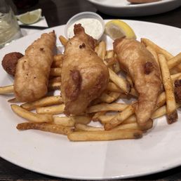 Fish and chips with fries and hush puppies Fish and chips with fries and hush puppies