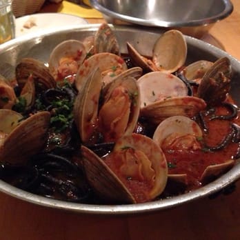 The Daily Catch - Black ink pasta with red seafood tomato sauce and clams. - Seafood Near Me - Brookline, Massachusetts The Daily Catch - Black ink pasta with red seafood tomato sauce and clams. - Seafood Near Me - Brookline, Massachusetts