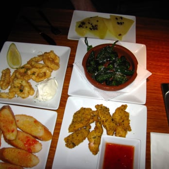 Wow - (clockwise) Bread, Calamari, Manchego, roasted peppers and chicken nuggets. - Tapas Bars Near Me - Barcelona, B Wow - (clockwise) Bread, Calamari, Manchego, roasted peppers and chicken nuggets. - Tapas Bars Near Me - Barcelona, B