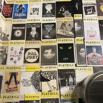 Julius’ - Vintage Playbill covers in the restroom - Gay Bars Near Me - New York, New York