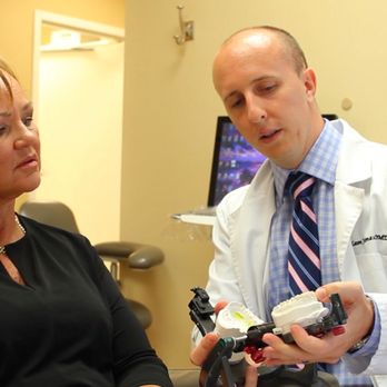 Premier Dental - Dr. Adam Jones educating his dental patient - Cosmetic Dentists Near Me - Vero Beach, Florida Premier Dental - Dr. Adam Jones educating his dental patient - Cosmetic Dentists Near Me - Vero Beach, Florida