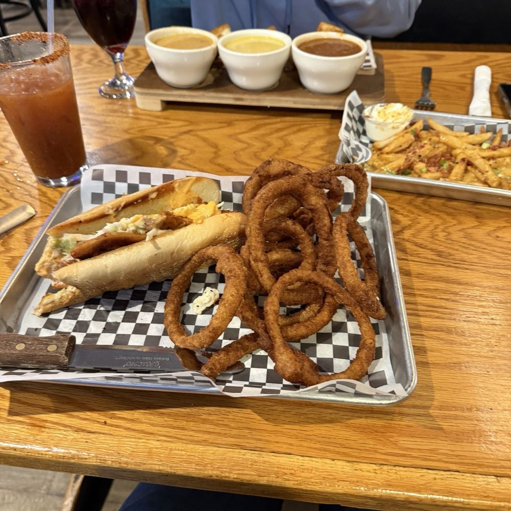Soup flight with grilled cheese, Korean bbq chicken bulgogi sandwich with onion rings, loaded fries. Soup flight with grilled cheese, Korean bbq chicken bulgogi sandwich with onion rings, loaded fries.