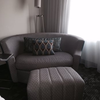 Courtyard by Marriott Jacksonville - This sleeper sofa even comes with a side table - Hotels Near Me - Jacksonville, North Carolina
