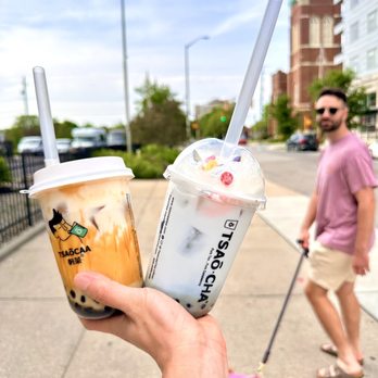 Tsaocaa - a person walking a dog on a leash - Bubble Tea Near Me - Indianapolis, Indiana