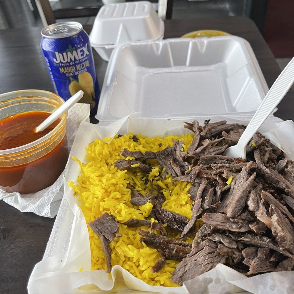 shredded beef and rice in a styrofoam container shredded beef and rice in a styrofoam container