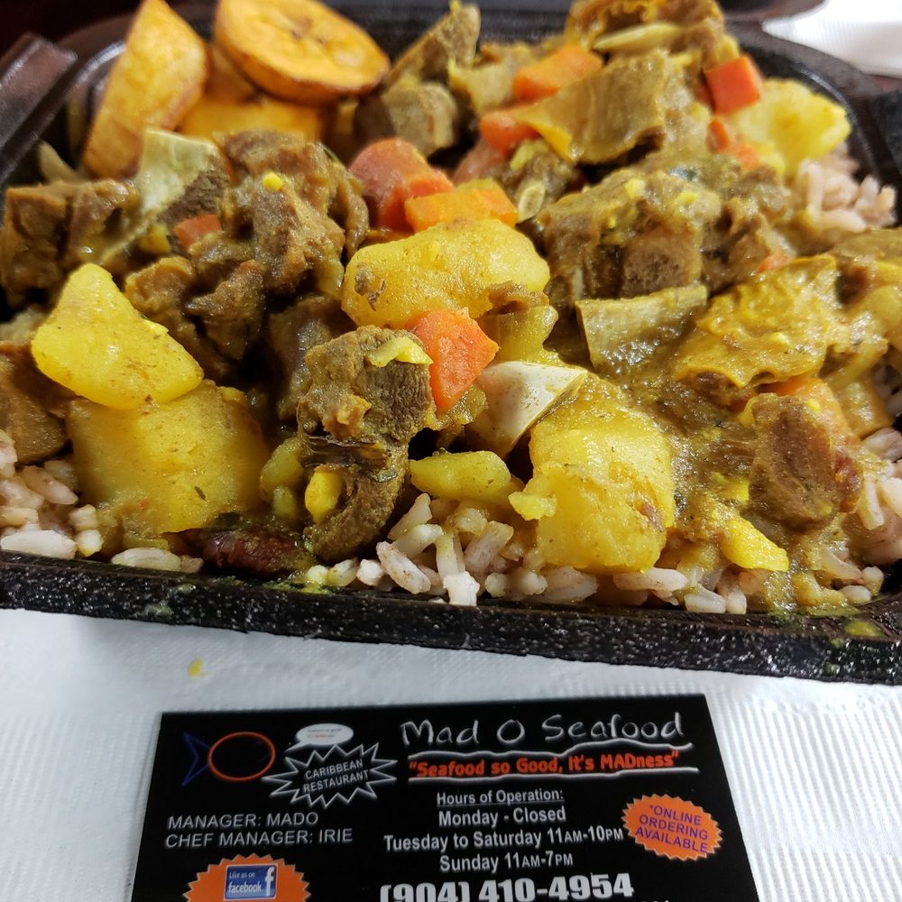 Mad O Caribbean and Seafood - JAMAICAN CURRY GOAT - Seafood Near Me - Jacksonville, Florida