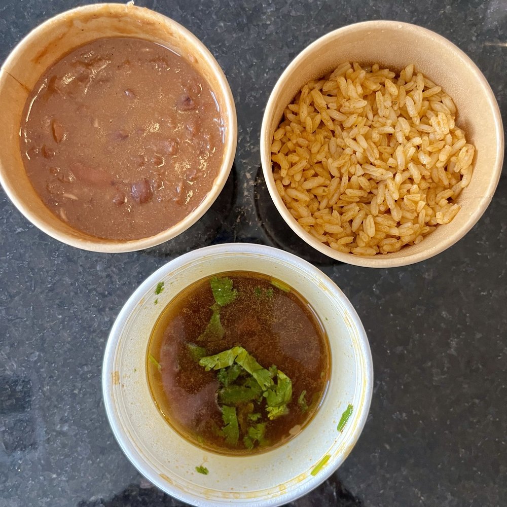 Sides of beans, rice, and au jus for birria tacos, which still lacked flavor! Sides of beans, rice, and au jus for birria tacos, which still lacked flavor!
