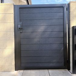 OC Local Garage Door & Gate - New metal frame and composite wood with a keypad in Los Alamitos by Oc Local Garage Doors And Gates