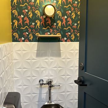 Triple Taproom & Kitchen - a toilet with a black seat - Breweries Near Me - Milwaukee, Wisconsin