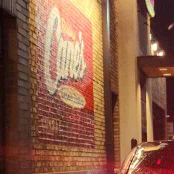 Raising Cane's Chicken Fingers - a car parked in front of a building - Fast Food Near Me - Conway, Arkansas
