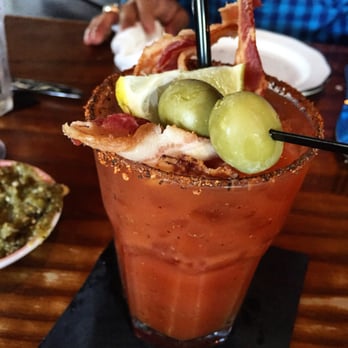 Tavern - (IG: @andy.elizabeth) Wicked Bloody Mary: house-infused Stoli + olives + bacon - New American Near Me - Nashville, Tennessee
