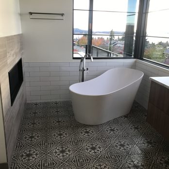 Tile and Style - a bathtub in a bathroom - Flooring Near Me Tile and Style - a bathtub in a bathroom - Flooring Near Me