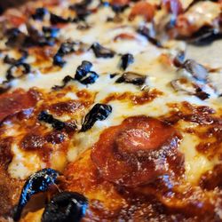 The Lighthouse Restaurant - Pepperoni pizza with black olives, mushrooms and extra cheese