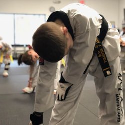 Himchari Martial Arts - Burke Commons - Stretching during our After School Program's taekwondo class.