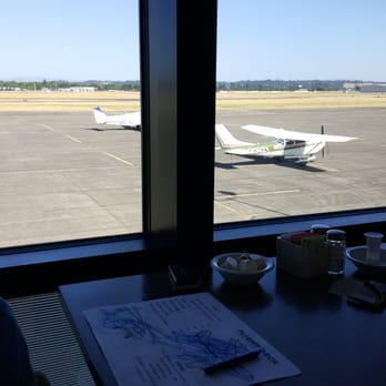Flight Deck Restaurant & Lounge - The view of the runway - Pubs Near Me - Salem, Oregon