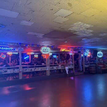 Broken Spoke - dancehall floor + neon beer signs - Music Venues Near Me - Austin, Texas